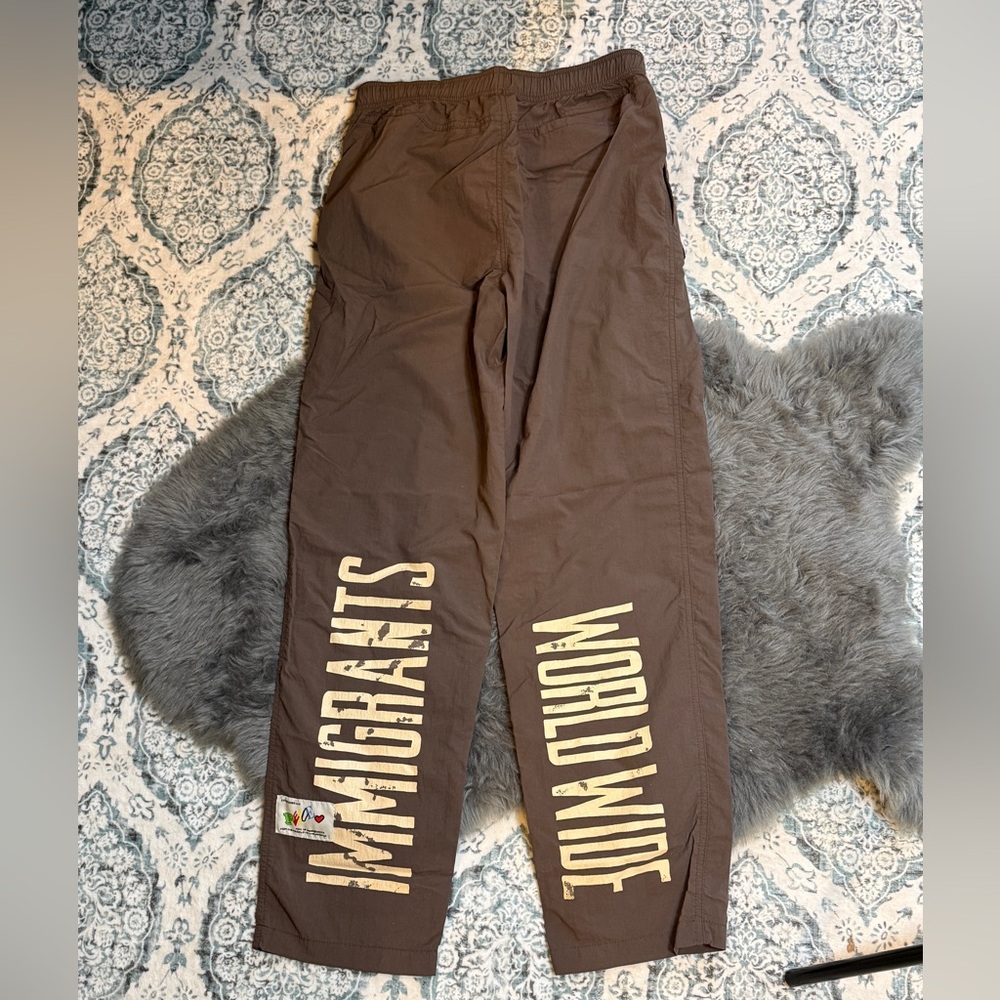 Kids of Immigrants Immigrants Worldwide Track pants Brown Small UNISEX